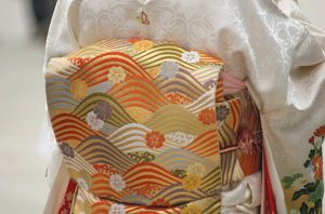 A Japanese silk kimono and silk obi belt